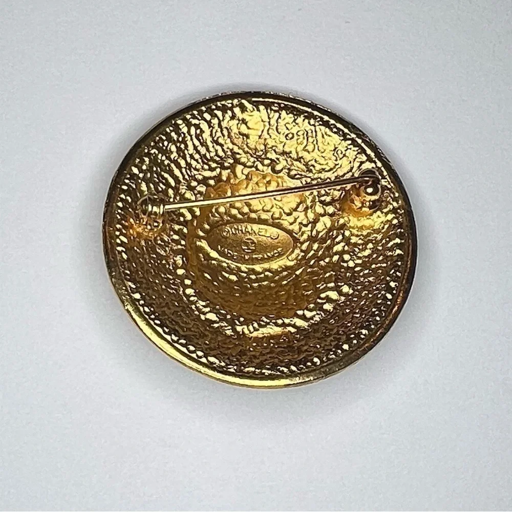 Vintage gold Chanel Brooch.